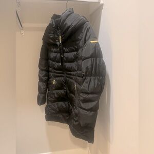 Women’s black puffer coat.